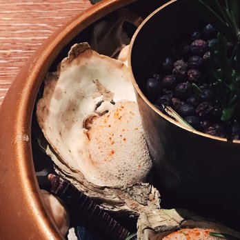 Lightkeepers - Coal roasted oysters topped with a champagne cucumber mignonette! - New American Near Me - Key Biscayne, Florida