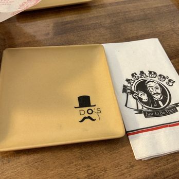 Macado's - a menu and napkins on a table - Burgers Near Me - Farmville, Virginia