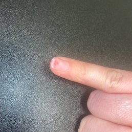 Huge hole in my pinky nail after she filed too thin.