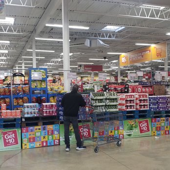 BJ's Wholesale Club - a woman shopping in a grocery store - Wholesale Stores Near Me - White Plains, New York BJ's Wholesale Club - a woman shopping in a grocery store - Wholesale Stores Near Me - White Plains, New York