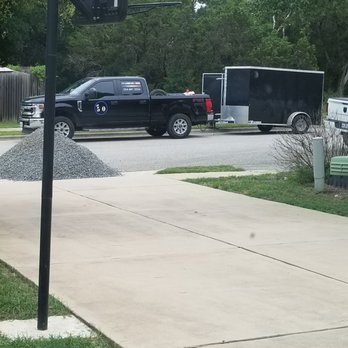 5-0 Landscape & Trees - The black river rock at the end of my driveway. - Tree Services Near Me