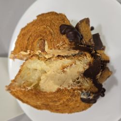 Butchertown Market - Peanutbutter chocolate croissant on a coffee saucer plate