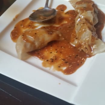 Wild Ginger - Shrimp ravioli in peanut sauce. - Asian Fusion Near Me - Great Neck, New York Wild Ginger - Shrimp ravioli in peanut sauce. - Asian Fusion Near Me - Great Neck, New York