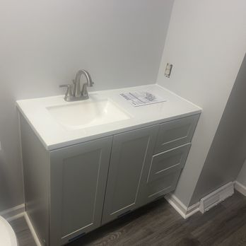 One Step Remodeling - a bathroom with a sink and toilet - General Contractors Near Me