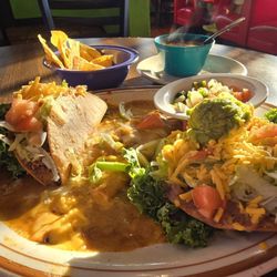 El Capitain plate with crispy taco, enchilada, & chalupa with side of beans and pico