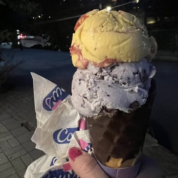 COWS - Bottom scoop blueberry, top scoop Peach Melba. Chocolate dip waffle cone. - Ice Cream & Frozen Yogurt Near Me - Whistler, British Columbia COWS - Bottom scoop blueberry, top scoop Peach Melba. Chocolate dip waffle cone. - Ice Cream & Frozen Yogurt Near Me - Whistler, British Columbia