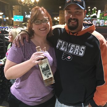 Canyon Diablo Distillery - a man and a woman at a bar - Distilleries Near Me - Flagstaff, Arizona Canyon Diablo Distillery - a man and a woman at a bar - Distilleries Near Me - Flagstaff, Arizona