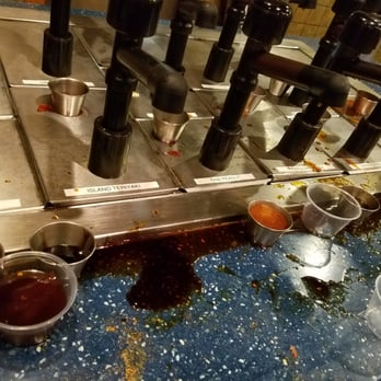 Blue Pacific Grill - Sauce area. "Clean spoon tub" was full of dirty spoons and gross also. No one could have cleaned all day. - Mongolian Near Me - Perrysburg, Ohio Blue Pacific Grill - Sauce area. "Clean spoon tub" was full of dirty spoons and gross also. No one could have cleaned all day. - Mongolian Near Me - Perrysburg, Ohio