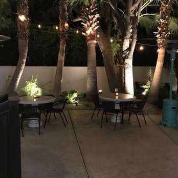 Del Rey - Portion of outdoor patio dining area. Even at night, there's more light than inside the restaurant. - Tapas Bars Near Me - Palm Springs, California