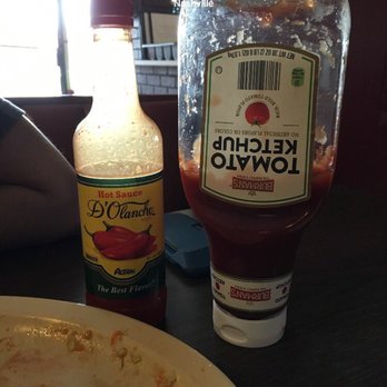 Restaurante Honduras - a plate of food and a bottle of ketchup - Honduran Near Me - Nashville, Tennessee