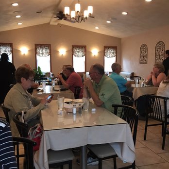 Ristorante Dell'Arco - a group of people sitting at a table - Italian Near Me - Endicott, New York Ristorante Dell'Arco - a group of people sitting at a table - Italian Near Me - Endicott, New York