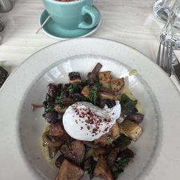 Sweet potato hash with poached egg, red pepper, spinach, and aioli
