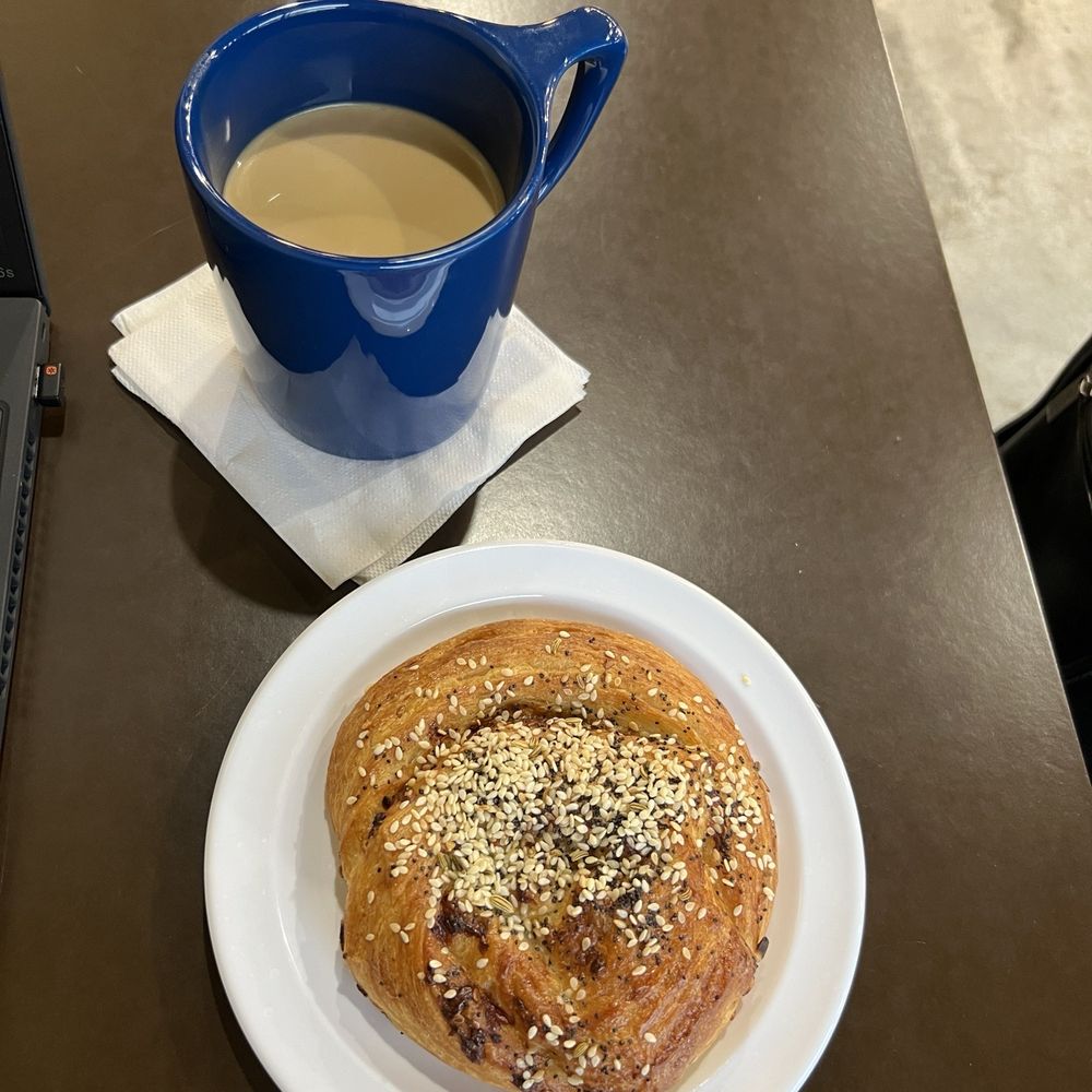 Americano with cream and a savory pastry Americano with cream and a savory pastry