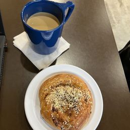 Americano with cream and a savory pastry Americano with cream and a savory pastry