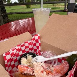 Maine Lobster Roll on a GF bun with fresh squeezed lemonade-- slaw and a pickle included