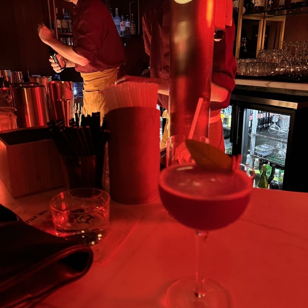 The Felix - a bartender pouring a drink at a bar - Bars Near Me - San Francisco, California
