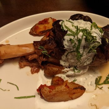 Tinos Kitchen + Bar - Slow Braised Lamb Shank - Mediterranean Near Me - Hampton, New Hampshire Tinos Kitchen + Bar - Slow Braised Lamb Shank - Mediterranean Near Me - Hampton, New Hampshire