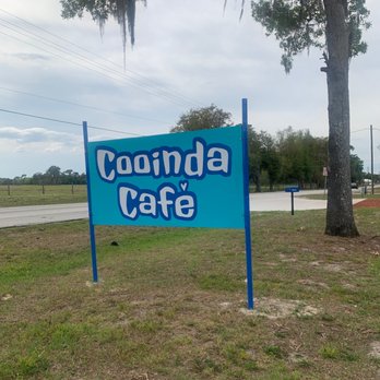 Cooinda Cafe - a sign in front of a tree - Cafes Near Me - Lake Panasoffkee, Florida Cooinda Cafe - a sign in front of a tree - Cafes Near Me - Lake Panasoffkee, Florida