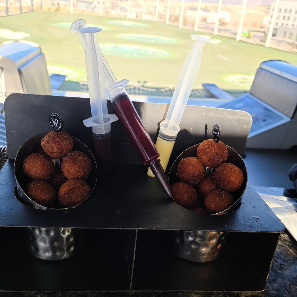Topgolf - Injectable donut holes. So much fun to eat - Sports Bars Near Me - Midvale, Utah Topgolf - Injectable donut holes. So much fun to eat - Sports Bars Near Me - Midvale, Utah