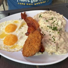 Biscuits and gravy with an added friend green tomato.