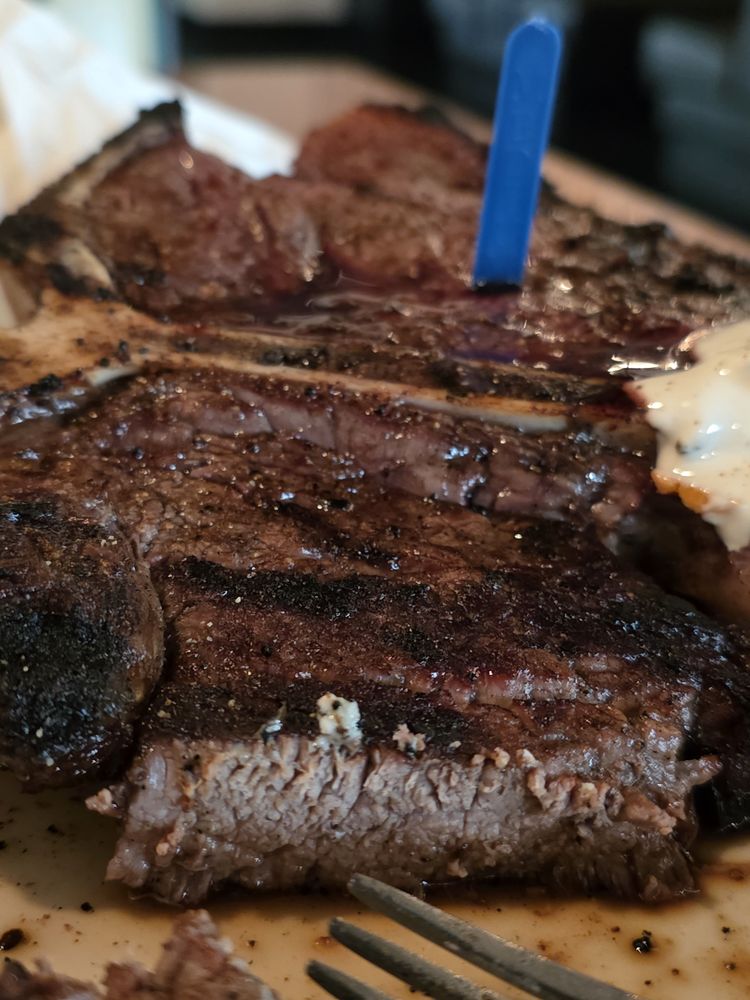 The Flame Steakhouse Logo