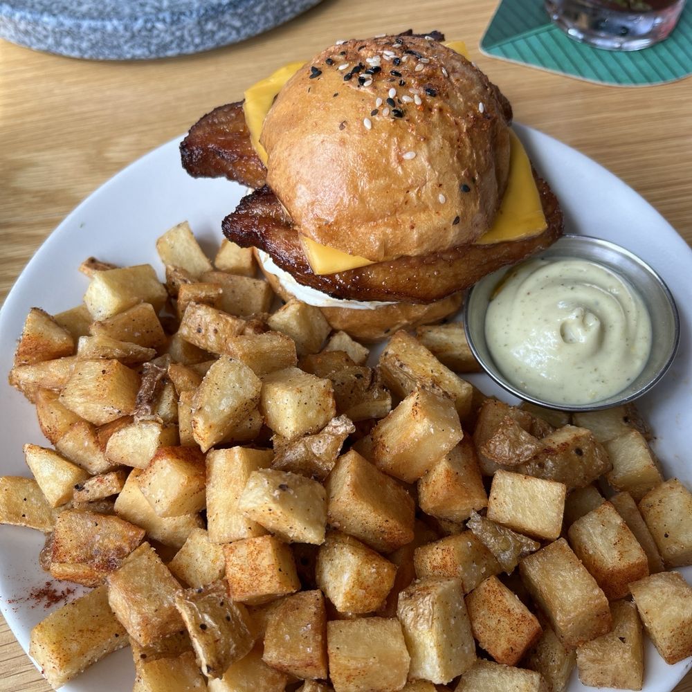 Yellowbelly - Egg sandwich (meat=pork belly) & a side of breakfast potatoes - New American Near Me - St. Louis, Missouri Yellowbelly - Egg sandwich (meat=pork belly) & a side of breakfast potatoes - New American Near Me - St. Louis, Missouri