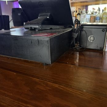 Lavaca Street Bar - Cleanliness. Just the surface? See atop the register and below... come on!!! - Sports Bars Near Me - Austin, Texas