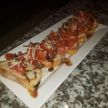 Assaggio's - Bruschetta appetizer, the perfect size to share with three people. - Italian Near Me - Raleigh, North Carolina Assaggio's - Bruschetta appetizer, the perfect size to share with three people. - Italian Near Me - Raleigh, North Carolina