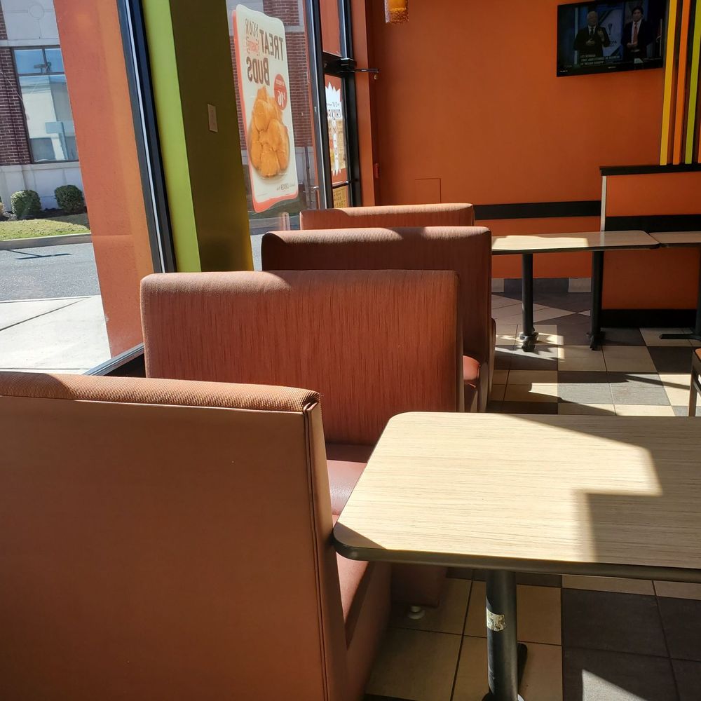 a table and chairs in a restaurant a table and chairs in a restaurant