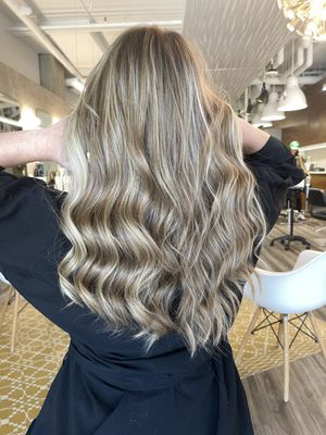 Balayage - Balayage allows for a more low-maintenance look compared to traditional highlighting methods, as there are no harsh lines or obvious regrowth. The technique offers a soft and gradual color change, enhancing the hair's texture and movement. It's a versatile option that suits various hair lengths and types, providing a natural and effortless appearance. After the balayage service, the client can enjoy a beautiful and modern hair color that grows out gracefully with minimal touch-ups required, making it a popular choice for those seeking a low-commitment yet stylish hair transformation.