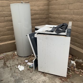 Pan American Properties - Stove, water heater and oven have been sitting in the dumpster since last October - Property Management Near Me - Tustin, California