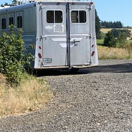 a horse trailer parked on the side of the road a horse trailer parked on the side of the road