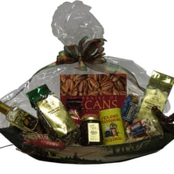 Classic Golden Pecans - Pirogue Basket! A pirogue is a flat-bottom boat-these are hand-painted by Louisiana native Rodney Lewis.  A unique gift idea!