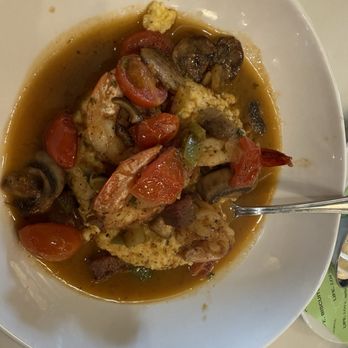 Delta Biscuit - Shrimp and Gouda grits with Tasso, mushrooms, and tomatoes. - Breakfast & Brunch Near Me - Monroe, Louisiana