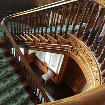 Iolani Palace - Majestic staircase no one is allowed to utilize while the tour took place.  Elevators took us to the other floors. This is KOA wood - Museums Near Me - Honolulu, Hawaii