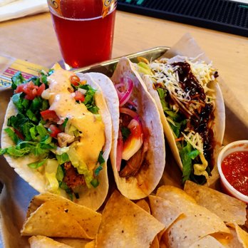 Big Kahuna - crispy calamari, sirracha beef, and Korean grilled chicken tacos with a Dr. Robot beer - American Near Me - Atlanta, Georgia