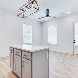 The One Clemson by Asset Living - Kitchen island overlook living space