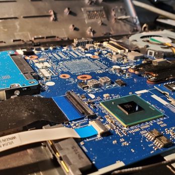 Tech 911 - Dusty Laptop Motherboard - IT Services & Computer Repair Near Me