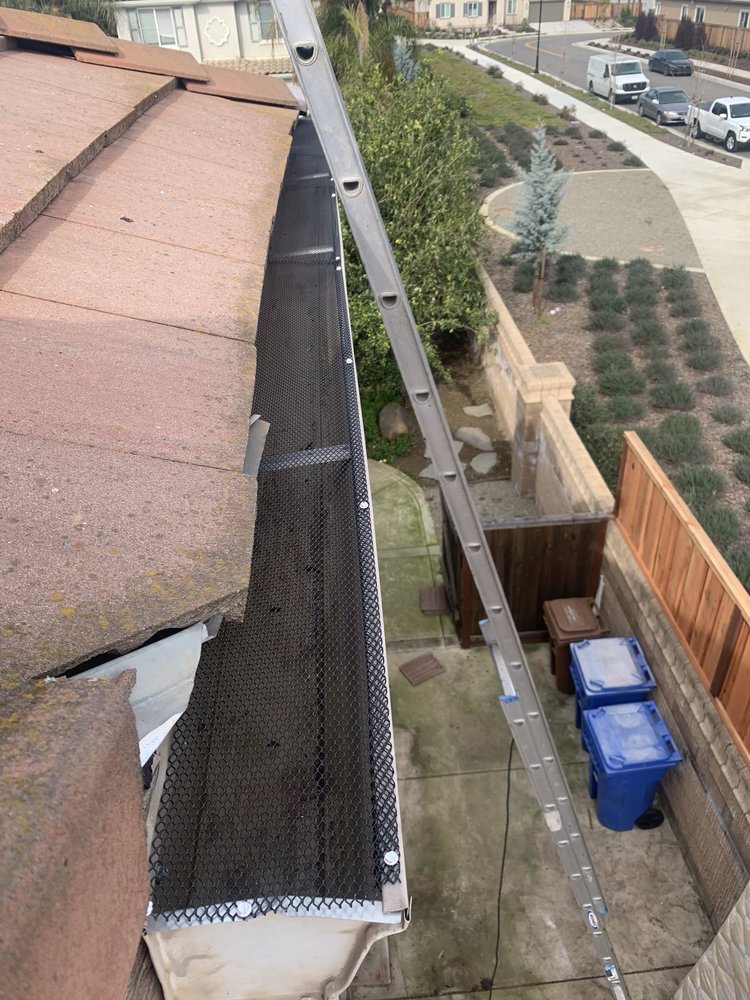 Slide of ML Gutters & Roofing