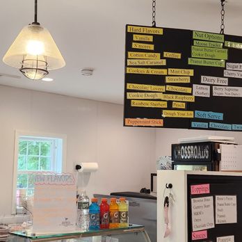 Crossroads - a woman sitting at a counter in a coffee shop - Ice Cream & Frozen Yogurt Near Me - Killingworth, Connecticut