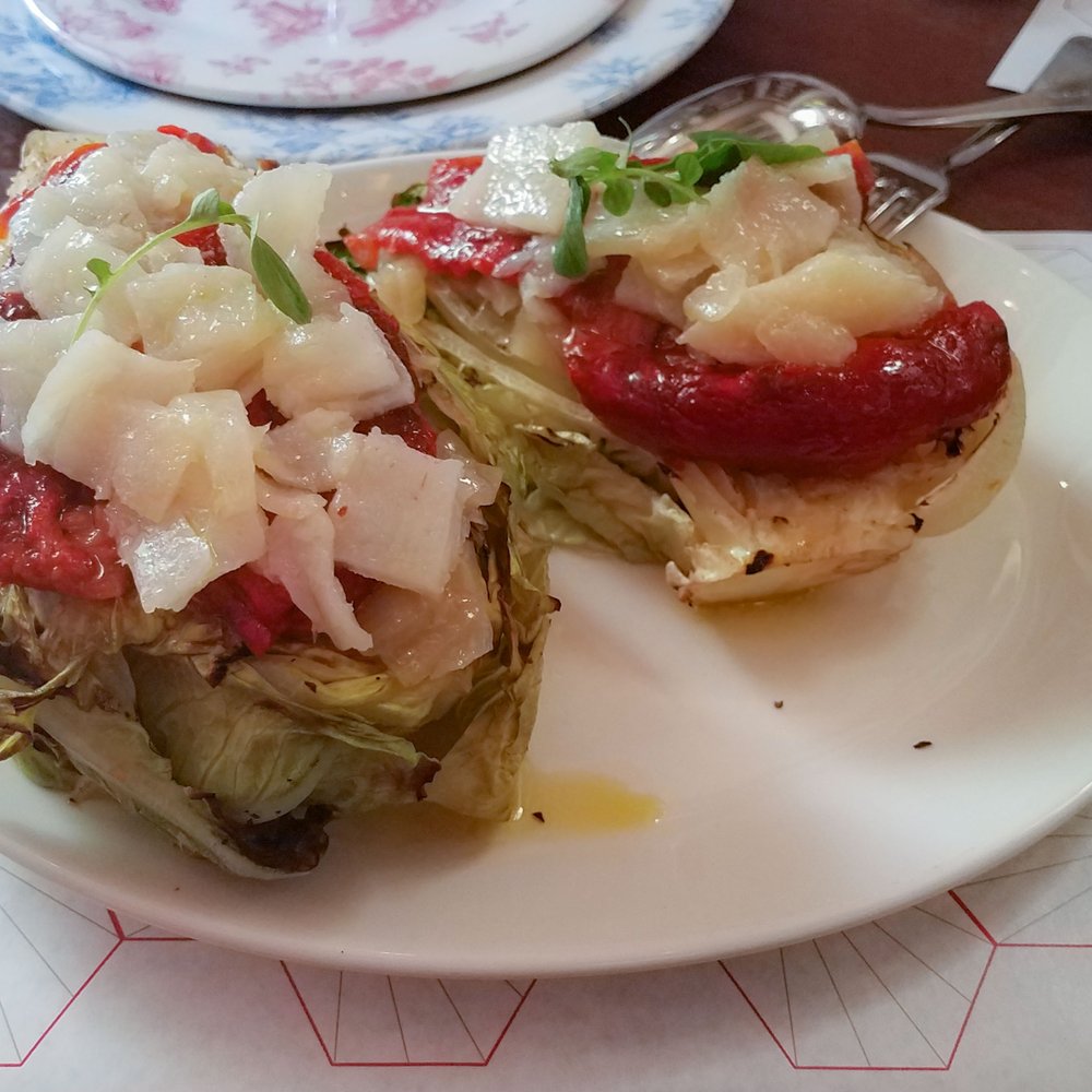 Tata Pila - lechuga entera a la parrilla, an entire head of grilled lettuce with candied scallions, peppers, grilled - Tapas Bars Near Me - Seville, SE