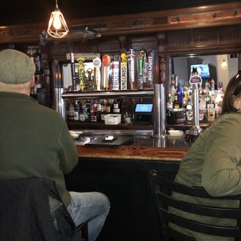 SpeakEasy Bar & Grill - two people sitting at the bar - New American Near Me - Newport, Rhode Island SpeakEasy Bar & Grill - two people sitting at the bar - New American Near Me - Newport, Rhode Island