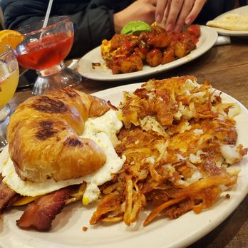 Bill's Cafe - their croissant breakfast sandwich and chilaquiles in the background - Breakfast & Brunch Near Me - San Jose, California