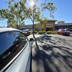 Tesla Supercharger - located across the Coach store