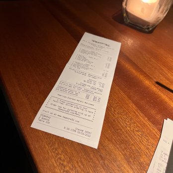 Seasons 52 - This is how the check was presented. I found that to be very tacky. Just my opinion. - New American Near Me - Houston, Texas
