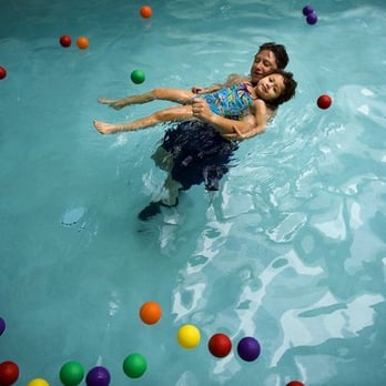 Ralph Richardson Center - Instructional assistant Elly Baraga works with Brooke Galicinao, 4, in the pool at Ralph Richardson Center. - Special Education Near Me - Carmichael, California Ralph Richardson Center - Instructional assistant Elly Baraga works with Brooke Galicinao, 4, in the pool at Ralph Richardson Center. - Special Education Near Me - Carmichael, California
