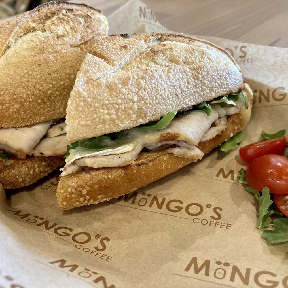 Mongo's Coffee - Left Coast - Real Roasted Turkey Breast with thick slices of triple cream brie, arugula and fig Jam - Coffee & Tea Near Me - Syosset, New York Mongo's Coffee - Left Coast - Real Roasted Turkey Breast with thick slices of triple cream brie, arugula and fig Jam - Coffee & Tea Near Me - Syosset, New York