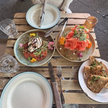 Le Great Outdoor - Heirloom tomato/burrata, watermelon salad, and bread - Mediterranean Near Me - Santa Monica, California Le Great Outdoor - Heirloom tomato/burrata, watermelon salad, and bread - Mediterranean Near Me - Santa Monica, California