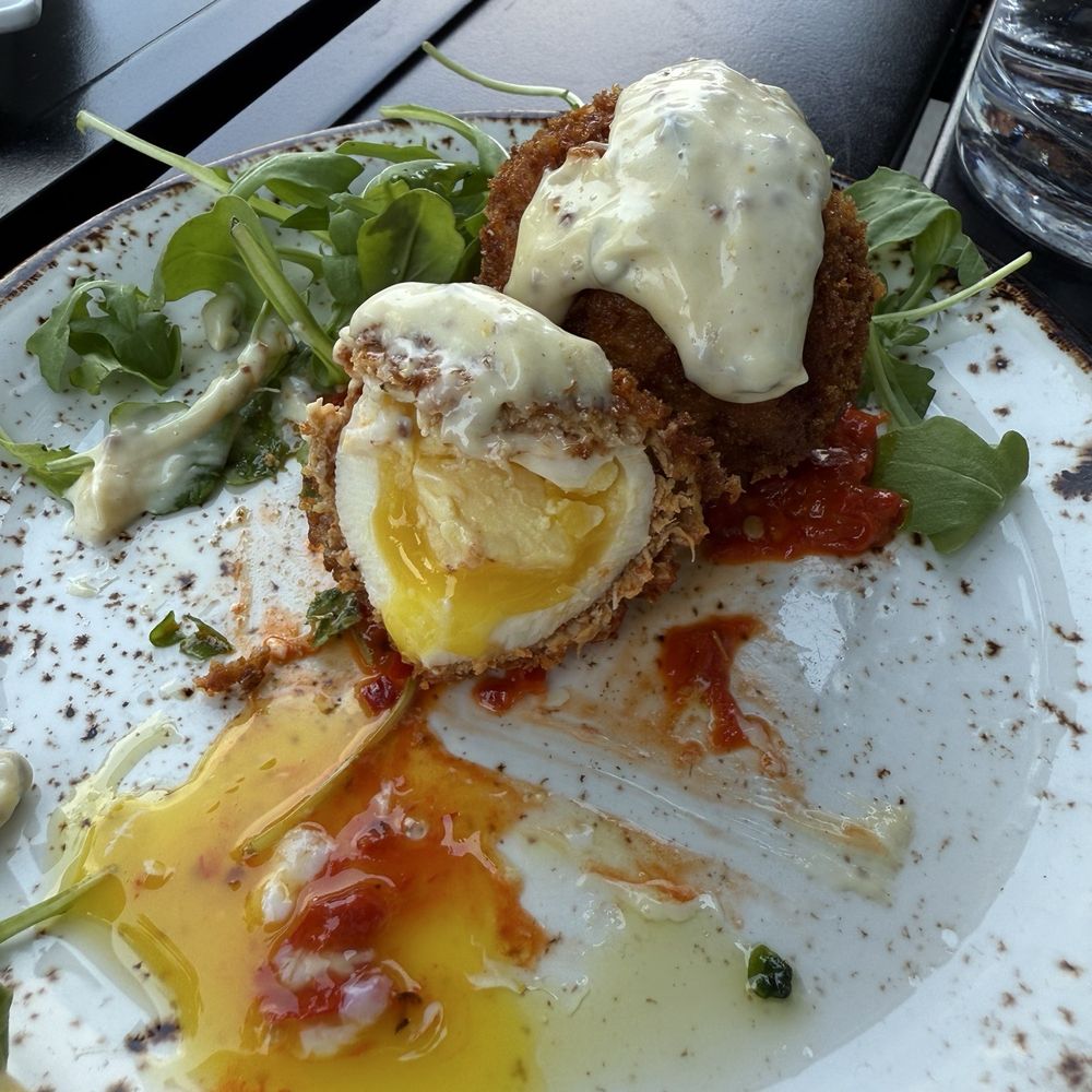 Half eaten scotch egg, still as good as I remembered. Half eaten scotch egg, still as good as I remembered.