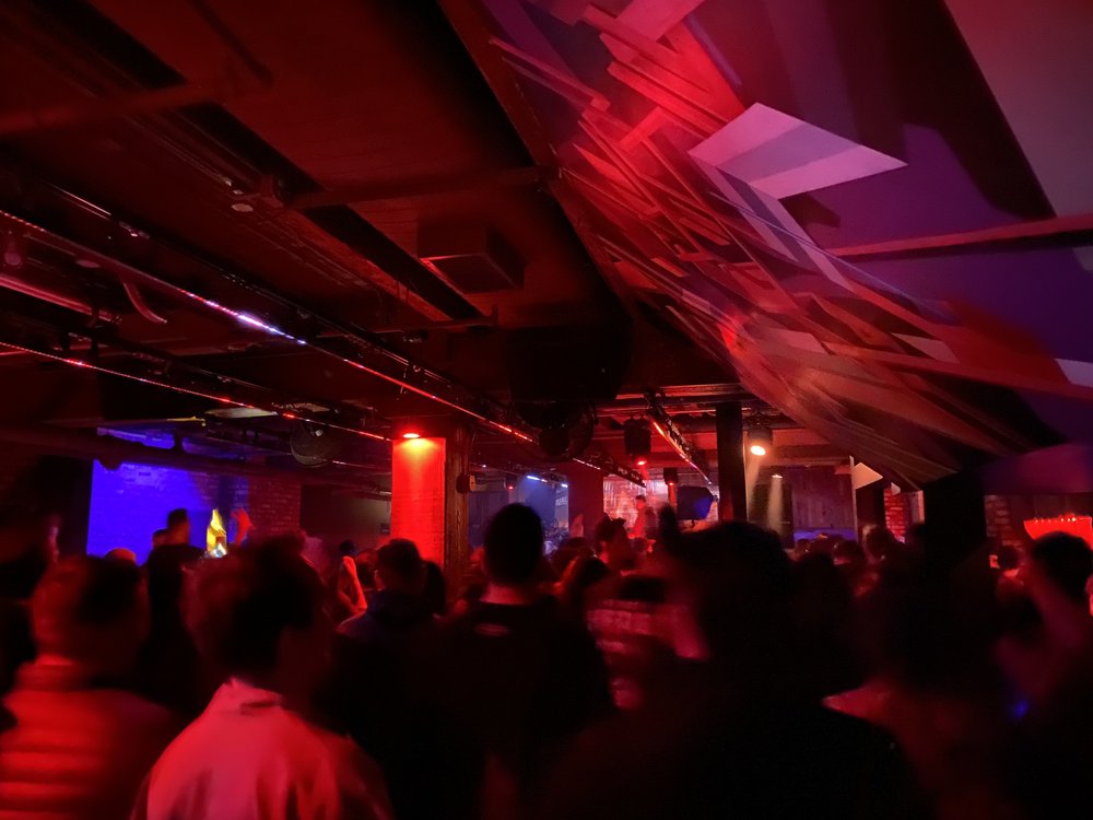 Spybar Chicago interior with red and purple LED lighting and crowded atmosphere